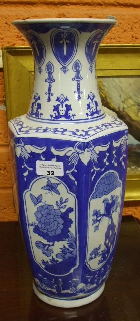A Blue and White Oriental Style Vase.
