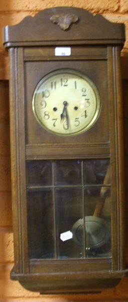 An Oak Cased Wall Clock.