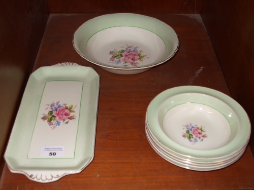 A `Wilkinson` Dessert Service with central floral sprays & apple green borders, comprising a serving