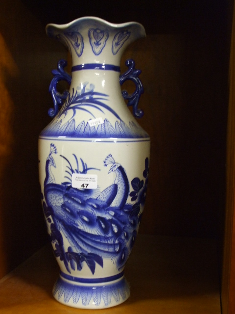 A Blue and White Oriental Style Twin Handled Vase.