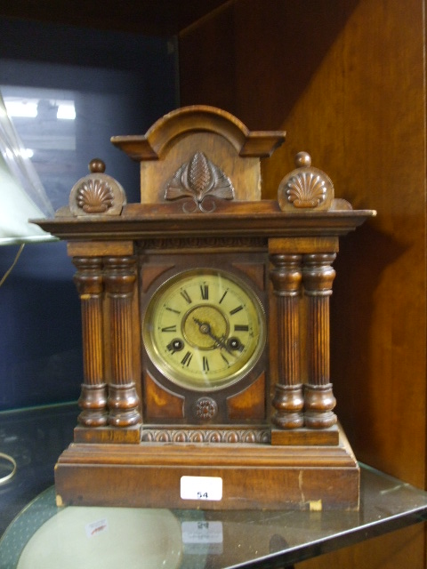 A Mahogany Mantel Clock, in Neo-Classical taste.