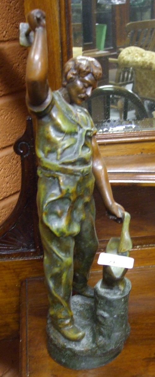 A Cast Figure of a Blacksmith.