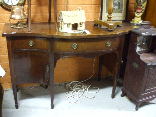 A 19th/Early 20th Century Mahogany Sideboard, with crossbanded top and serpentine front.