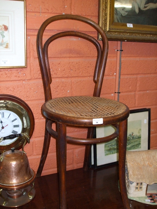 A Bentwood Chair with Cane Seat.