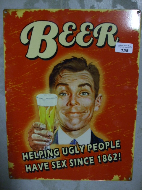 A Reproduction Humorous Metal Sign, `Beer`.