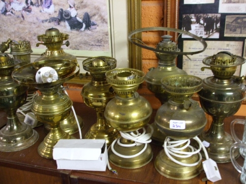 A Quantity of Brass Oil Lamps, some converted to electricity.