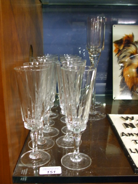 A Set of Twelve Crystal Champagne Flutes and Two Tasting Glasses.