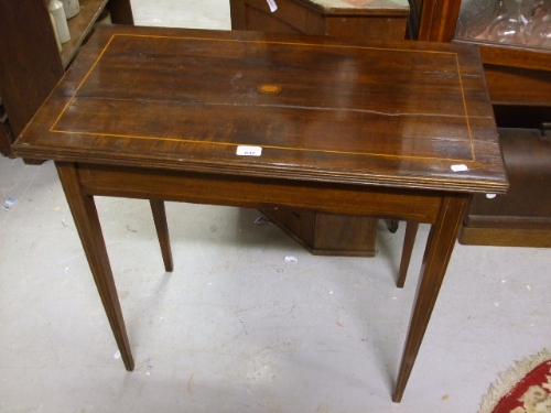 An Edwardian Mahogany and Inlaid Side Table.