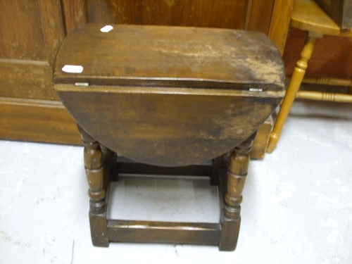 A Miniature Oak Drop-Leaf Table.