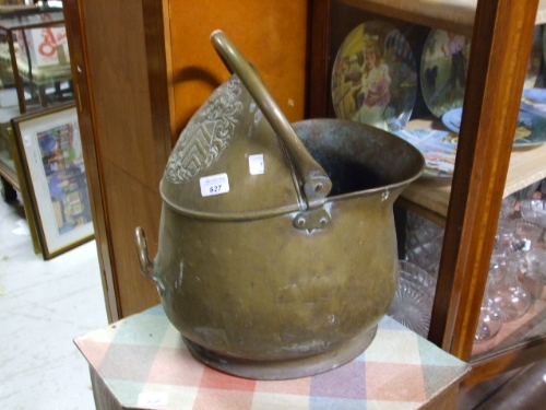 A 19th Century Brass Coal Scuttle Embossed with Heraldic Crest.