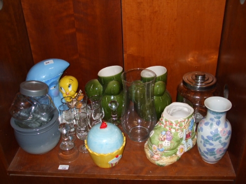 A Shelf of Glass and Ceramics including nursery ornaments.