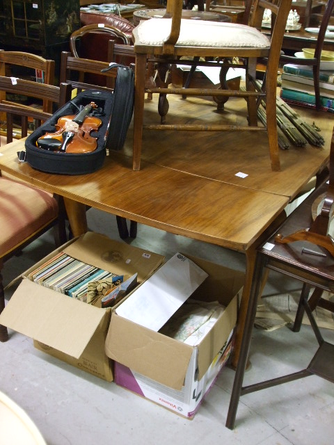 An Early 20th Century Walnut Drawer-Leaf Dining Table.