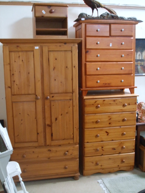 A Quantity of Pine Bedroom Furniture, to include a wardrobe, two chests of drawers and a bedside