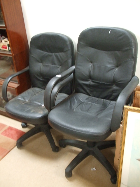 Two Office Chairs, with leather effect upholstery.