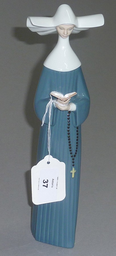 Lladro figure of a nun.