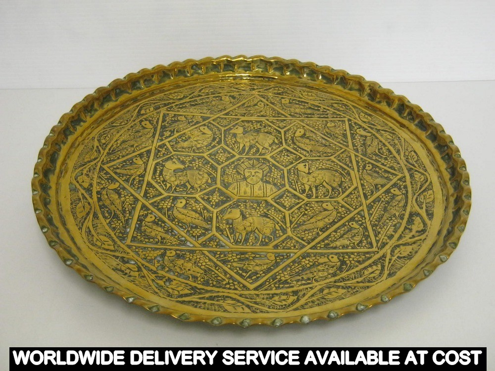 Eastern circular stamped brass tray with animal designs - diameter 39cms approximately