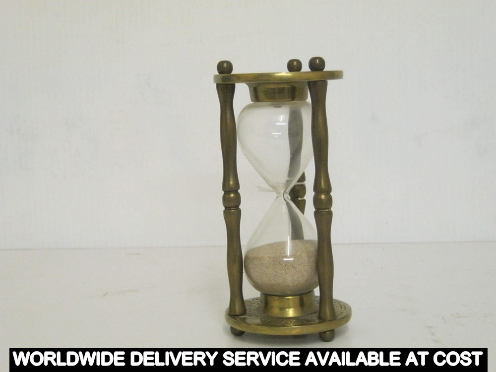 Egg timer on brass stand - 15cms high approximately