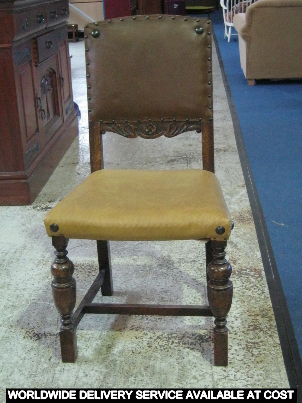 Carved oak single chair - the square back with studded upholstery panel - stuffover upholstered seat