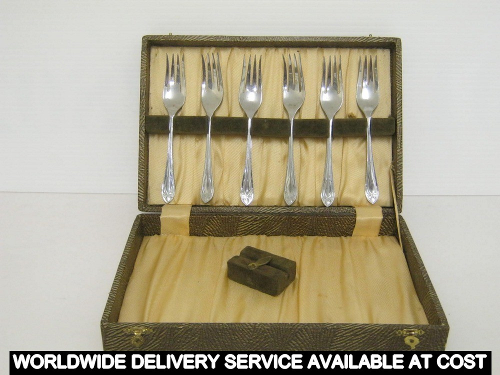 Chrome plated cake forks in a display box
