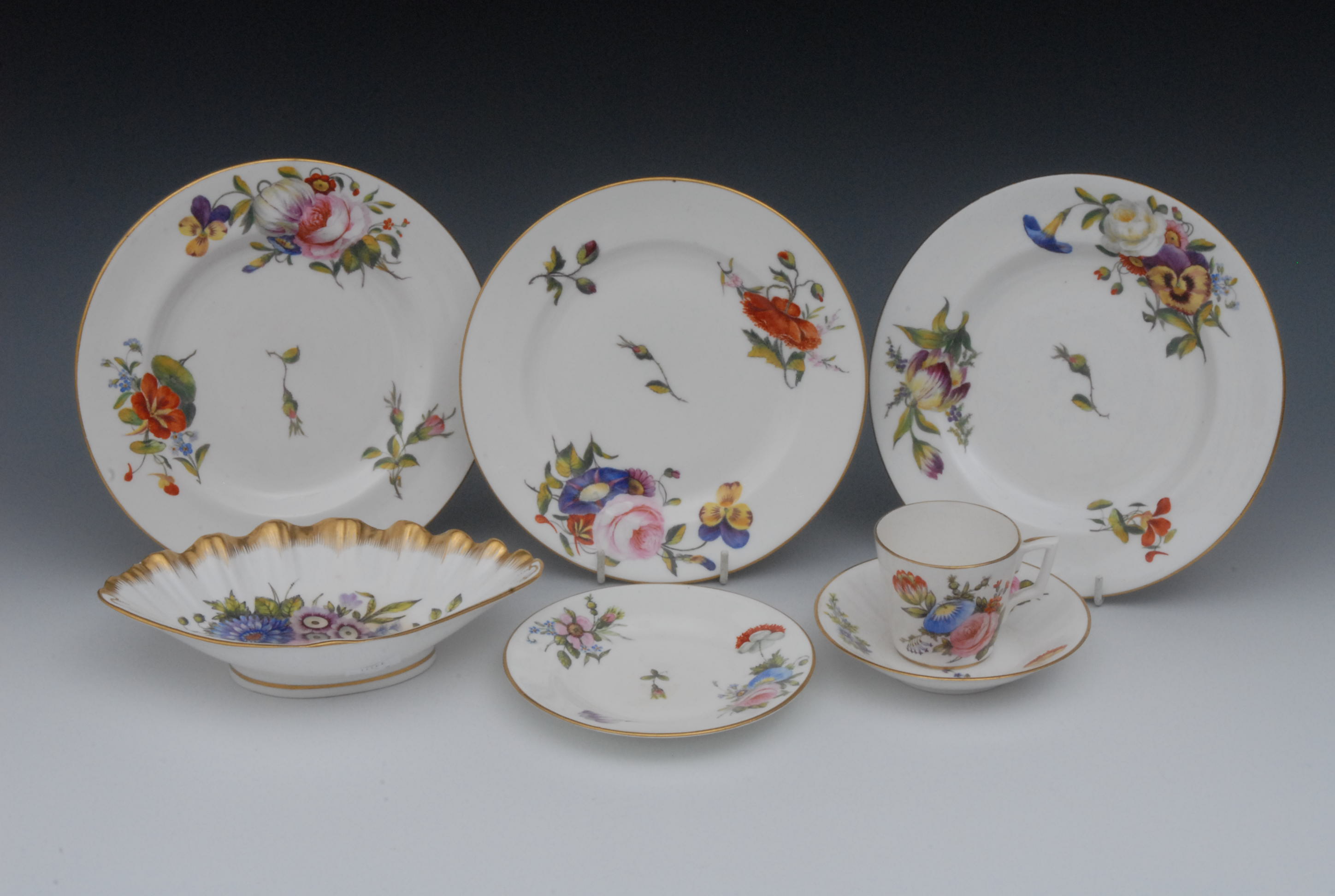 A set of three Sampson Hancock side plates, well painted with colourful summer flowers, gilt line