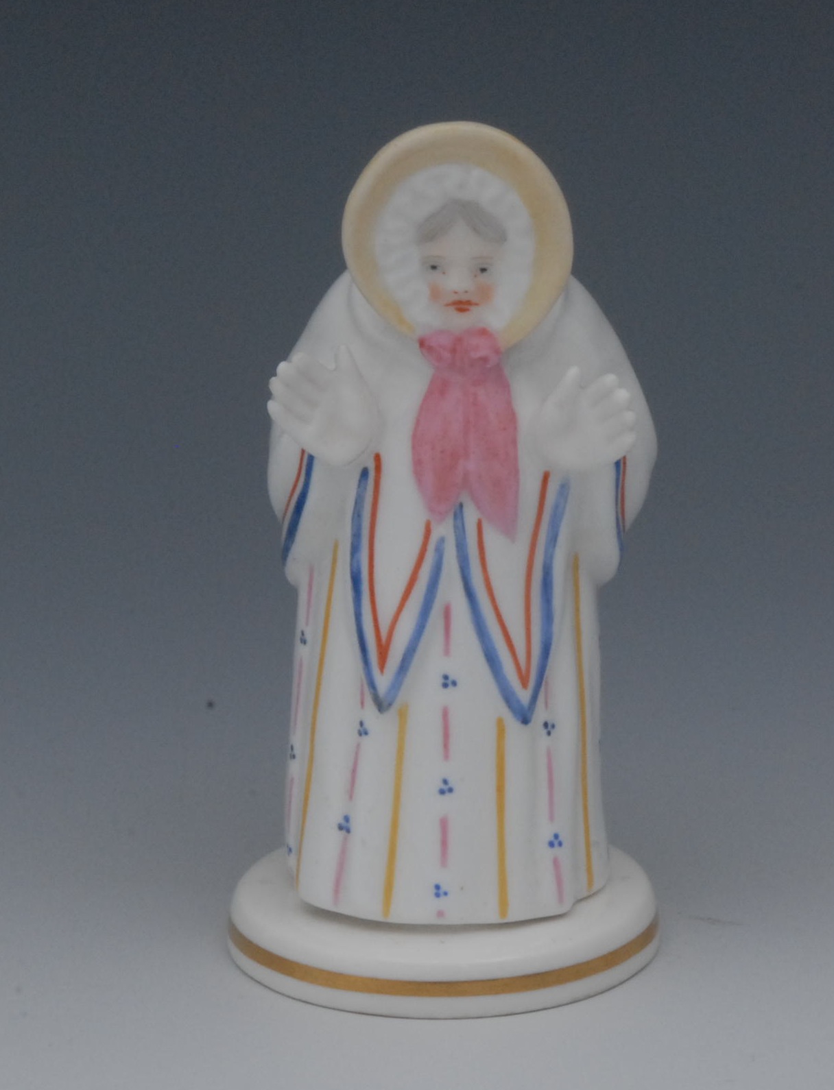 A Sampson Hancock novelty candle snuffer, Sarah Gamp, she stands wearing a yellow bonnet, white