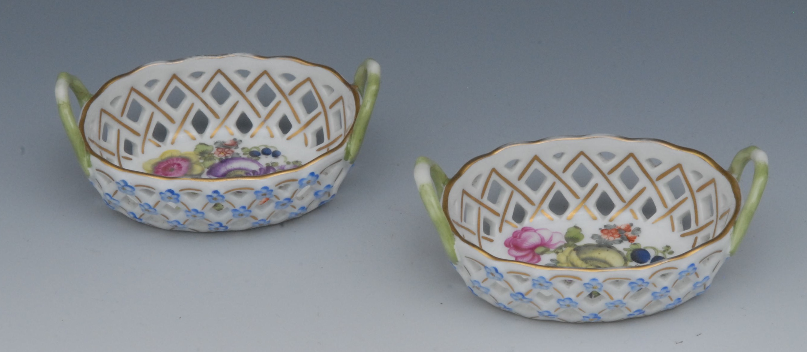 An associated pair of Sampson and Hancock two-handled baskets, decorated with colourful summer