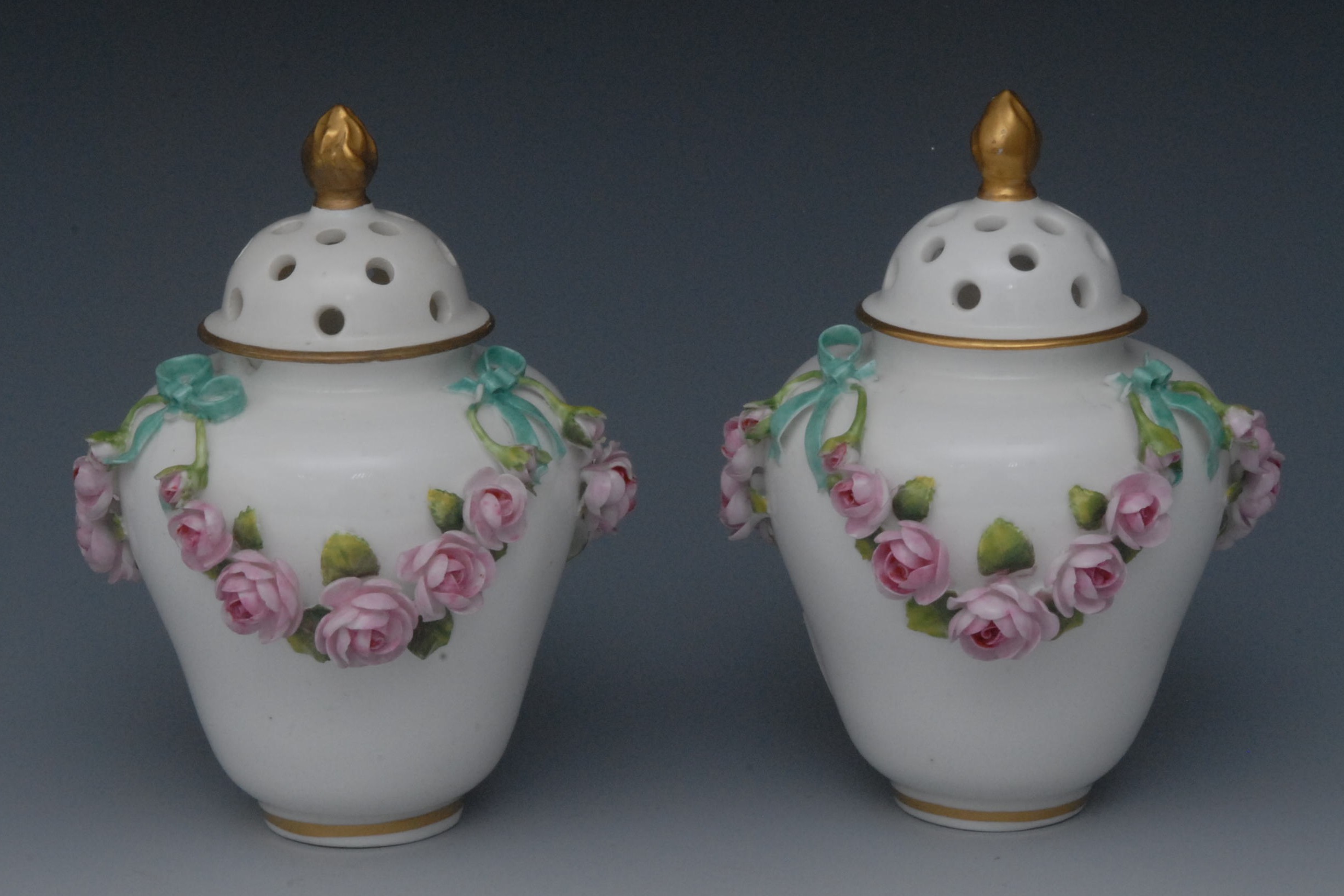 An associated  pair of  Sampson Hancock Derby ogee shaped pot pourri vases and covers, gilt flame