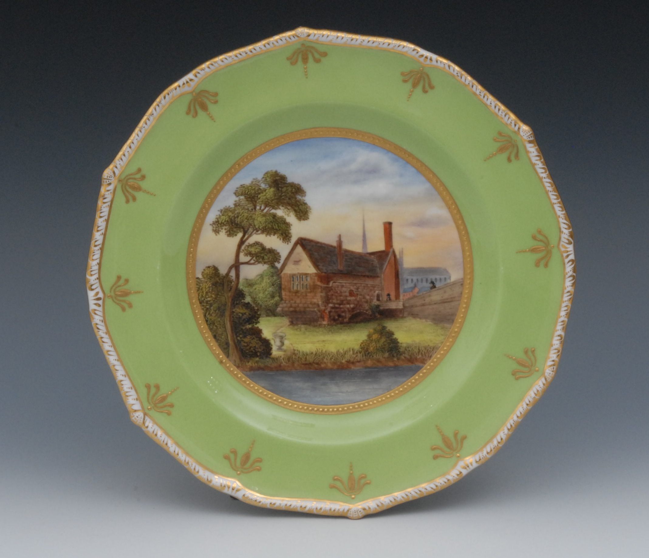 A Sampson Hancock shaped circular plate, painted by Harry Sampson Hancock, signed, with St Mary`s by