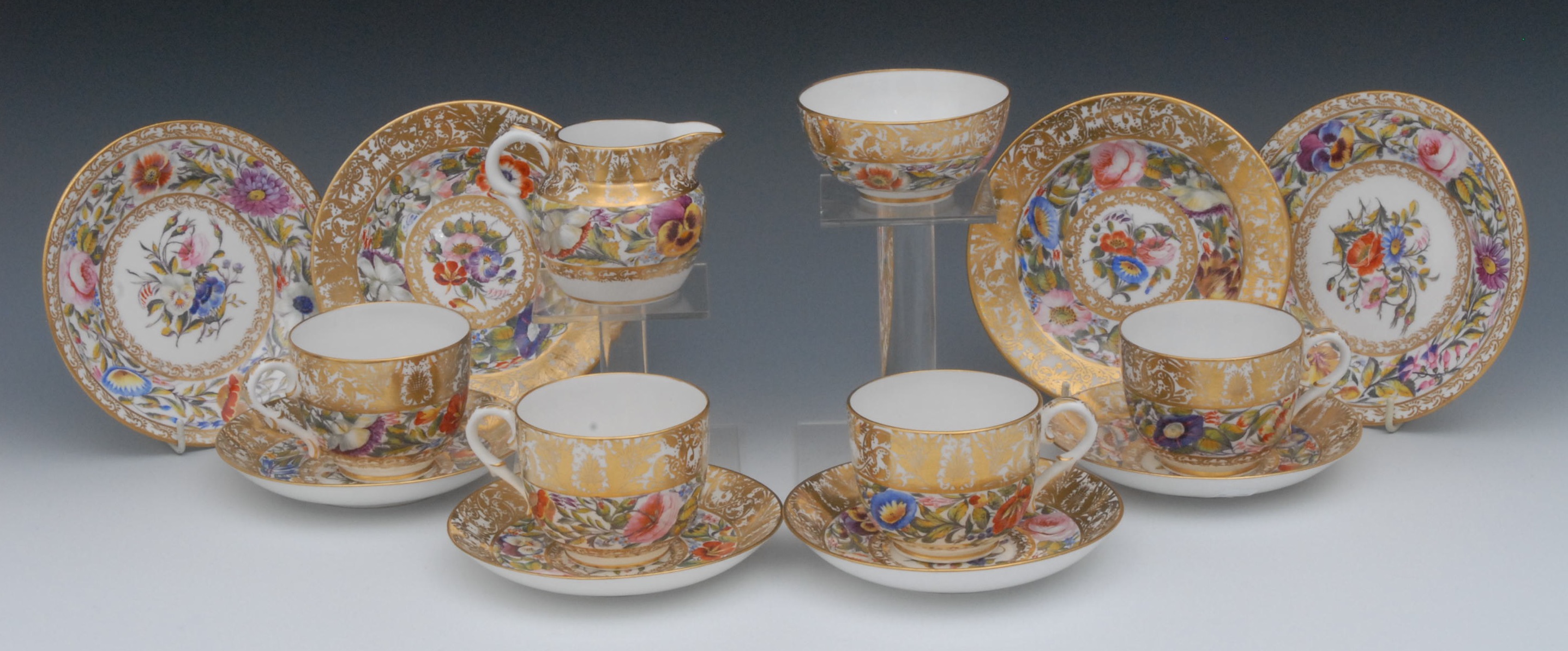 A Sampson Hancock part tea service, comprising four teacups, saucers and side plates milk jug and