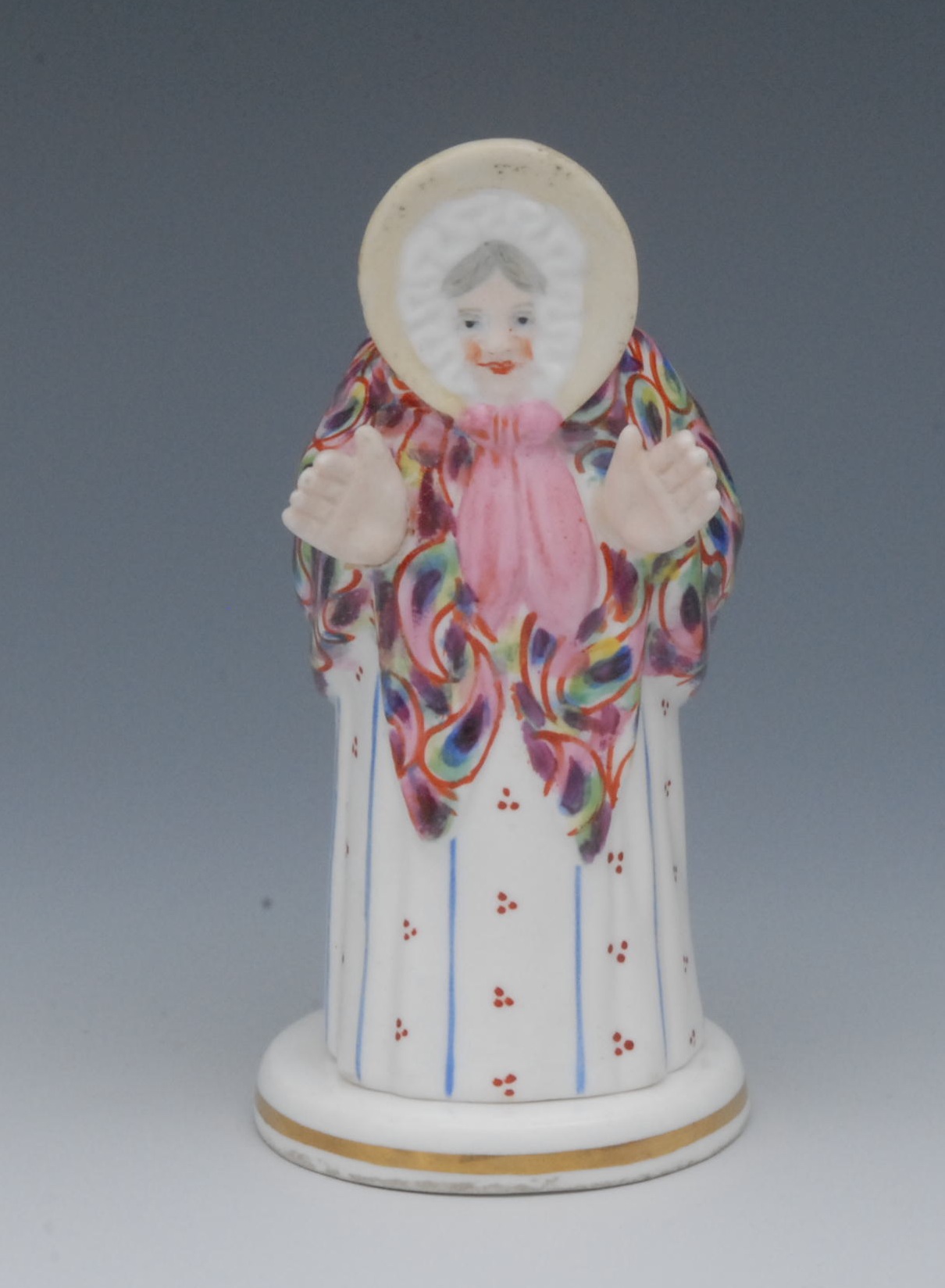 A Sampson Hancock novelty candle snuffer, Sarah Gamp, she stands wearing a bonnet, paisley shawl and