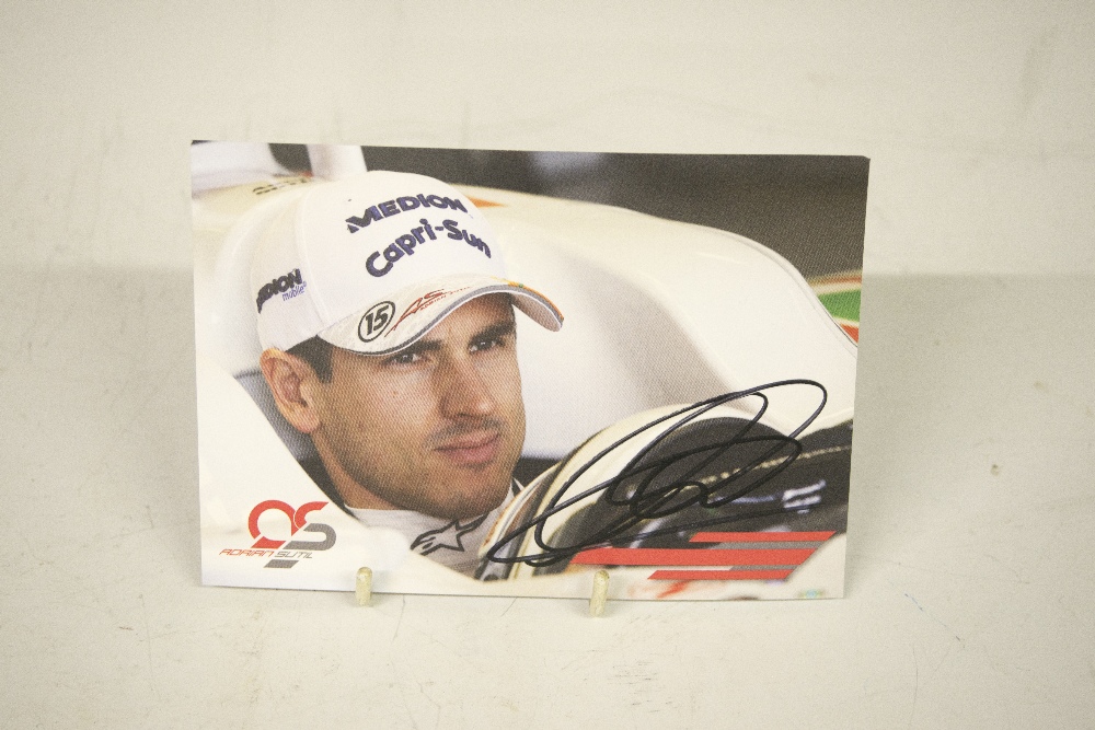 A Force India FI team postcard signed by Adrian Sutil