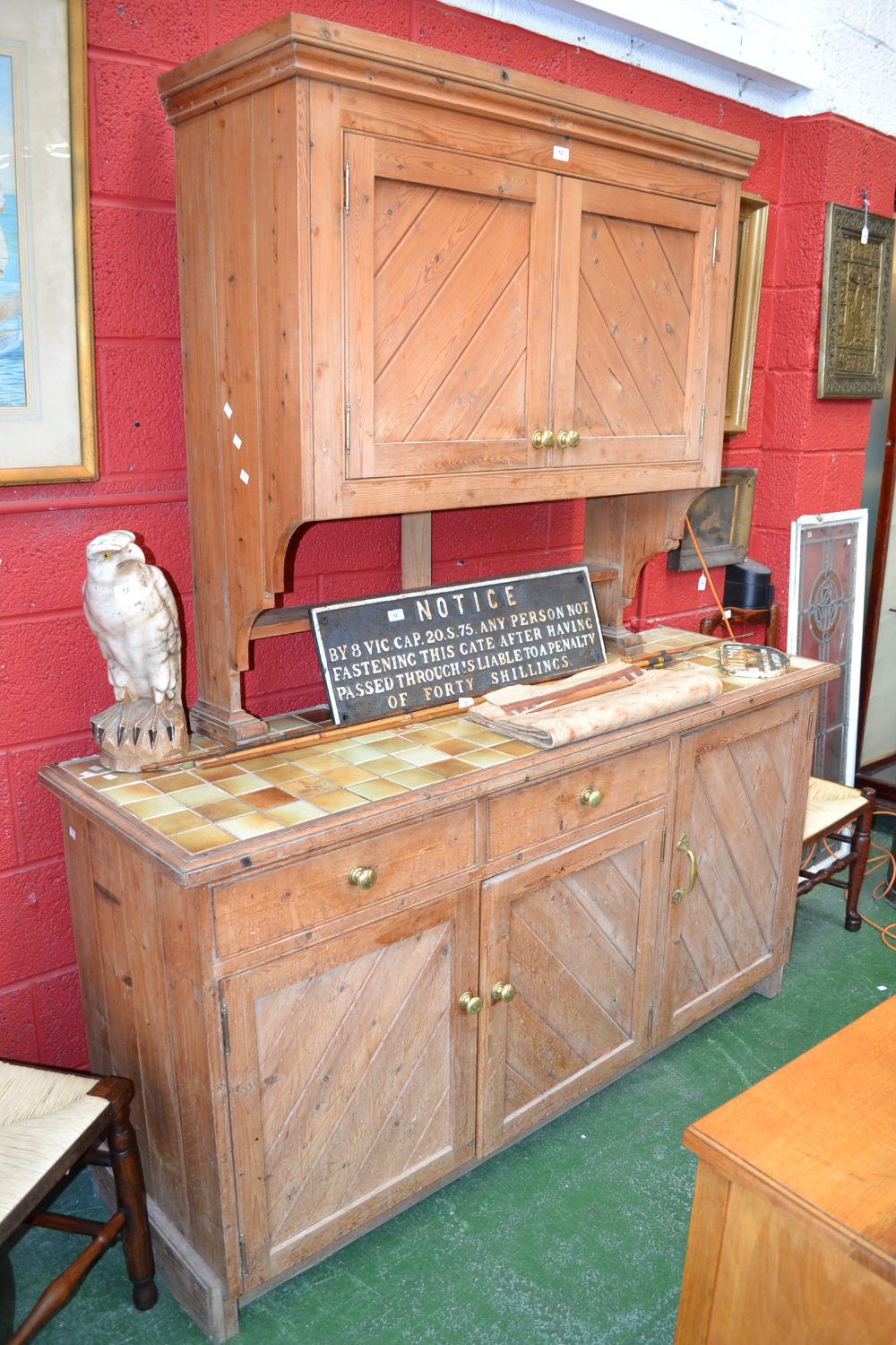 A large pine freestanding kitchen cabinet, constructed from reclaimed timber.