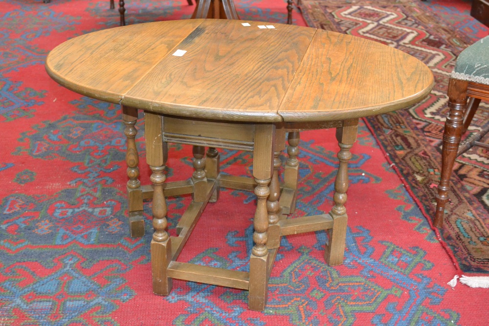 An old charm oak drop leaf table