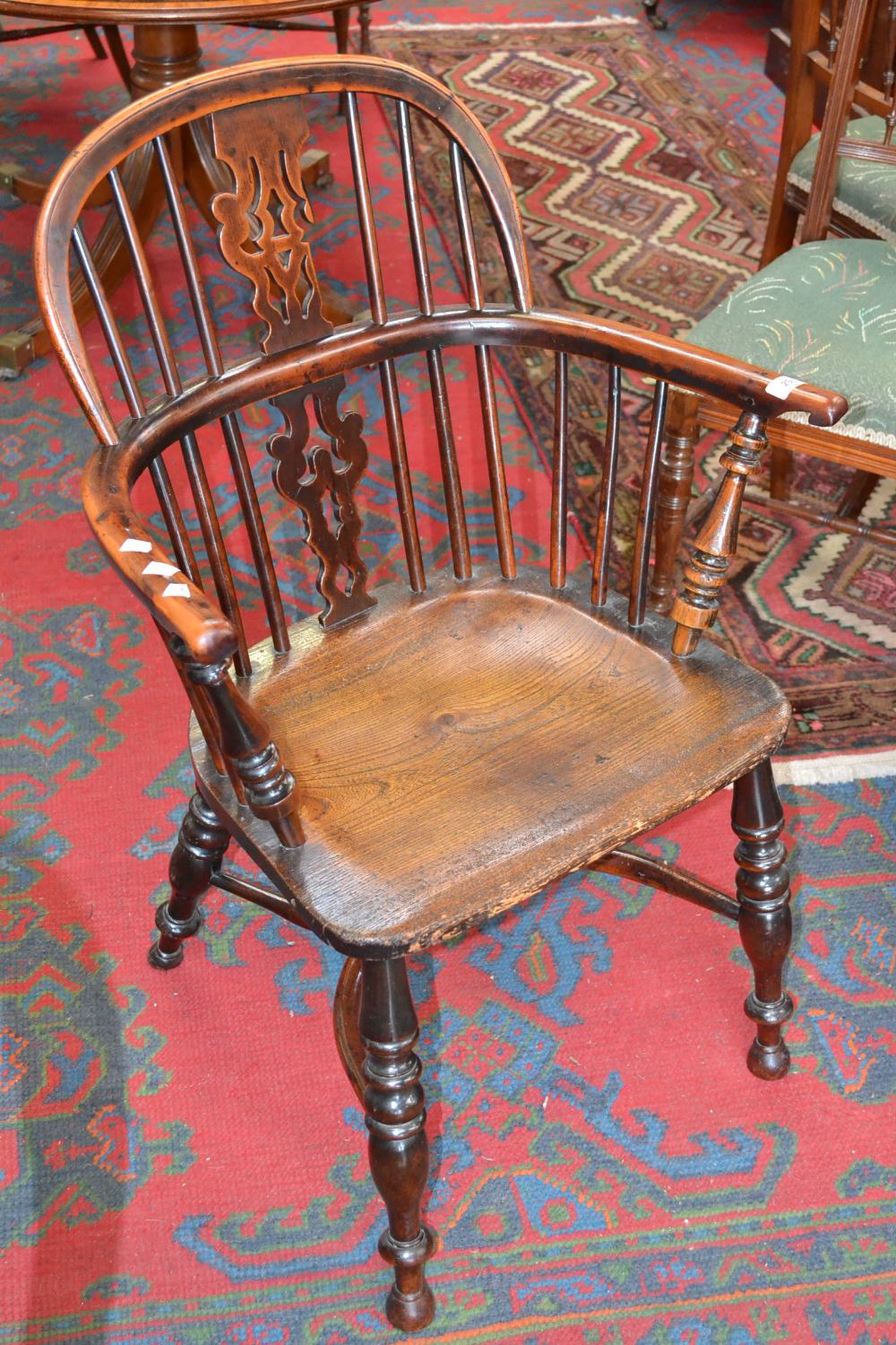 A yew wood and elm Windsor open armchair, shaped and pierced splat, spindle back, turned supports,