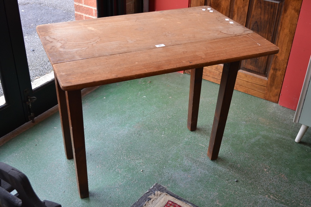 A distressed rectangular kitchen side table, with single narrow drop leaf, square tapering supports