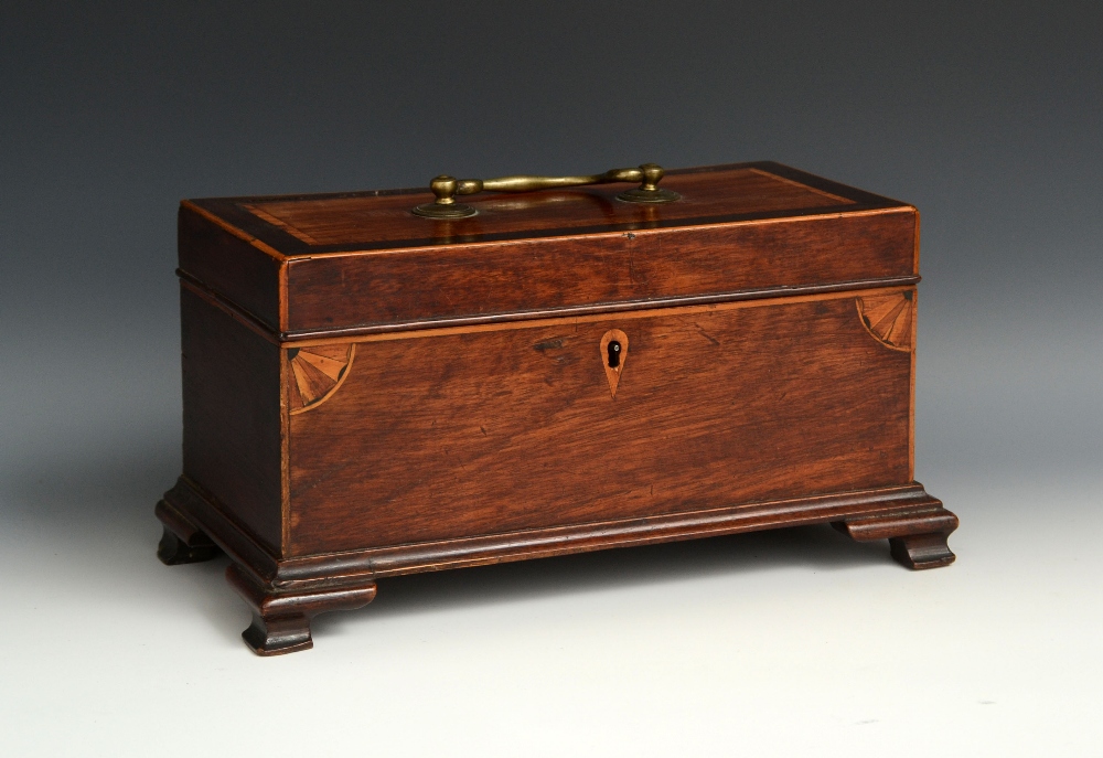 A George III mahogany rectangular tea caddy, hinged crossbanded cover with brass swan neck handle,