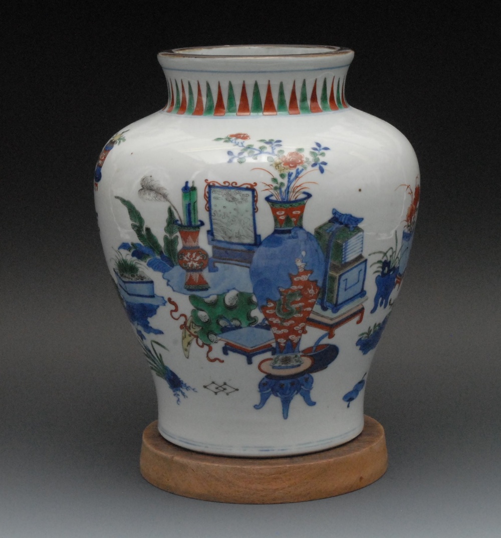 A Chinese baluster vase, decorated in cobalt blue, green, yellow and iron red with precious objects,