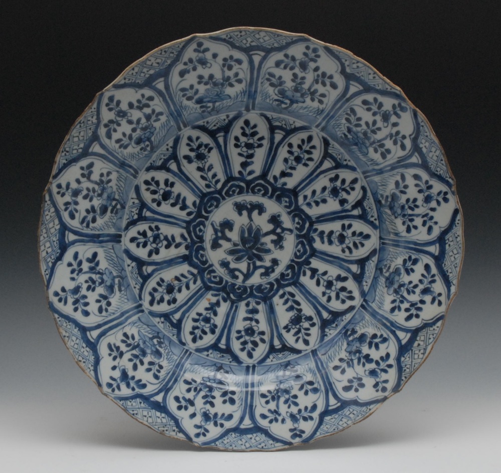 A  17th century Chinese shaped circular blue and white `Mohhaedan` charger, the field painted in