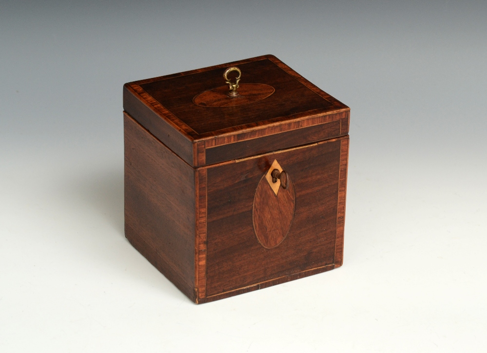 A George III crossbanded mahogany rectangular tea caddy, of small proportions, hinged cover with