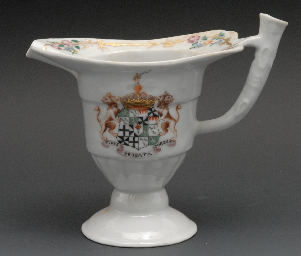 A Chinese Armorial helmet shaped cream jug, painted in polychrome with arms of Hugh Hume, fluted