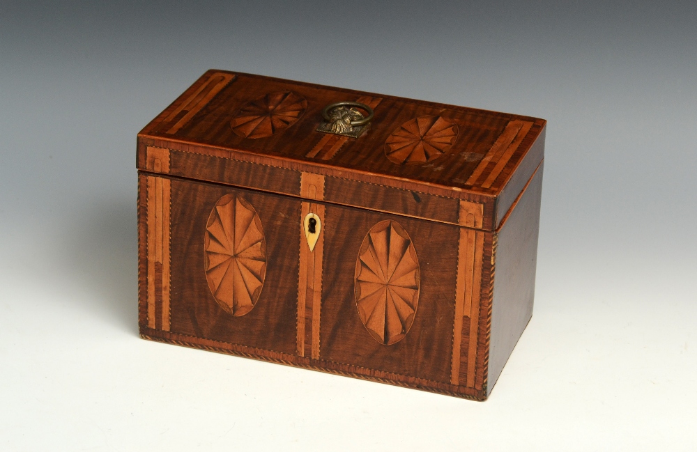 A George III fiddle back mahogany rectangular tea caddy, hinged cover with brass lion mask handle,