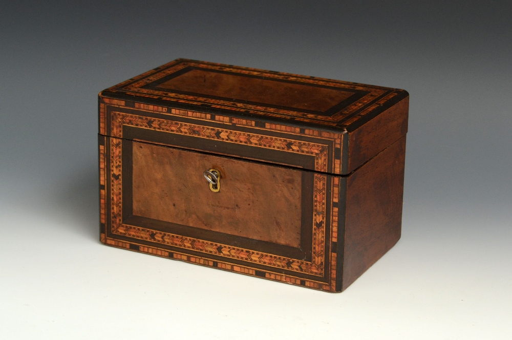 A Victorian walnut and parquetry rectangular tea caddy, hinged cover enclosing a pair of lidded