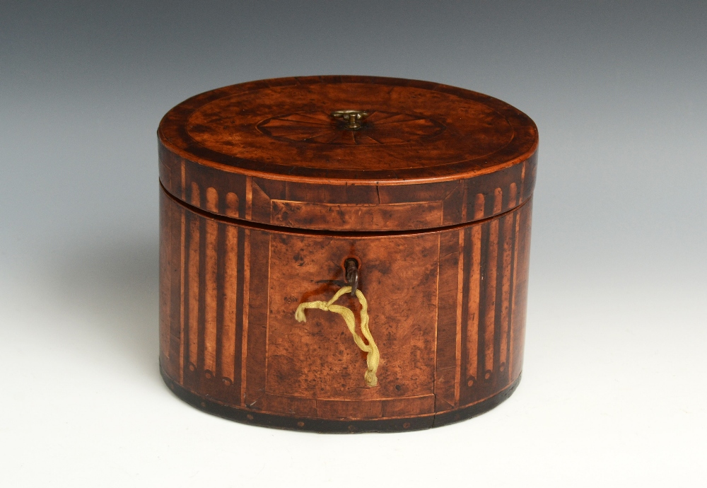 A George III Neo-Classical mahogany crossbanded burr yew oval tea caddy, hinged cover with brass