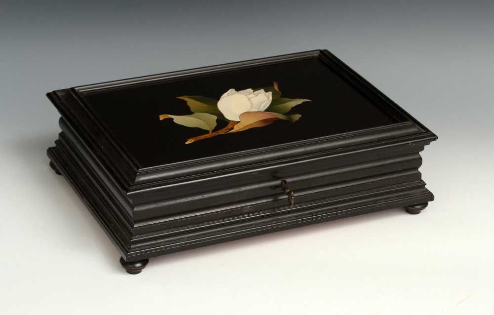 A 19th century Continental pietra dura and ebonised table casket, hinged cover inlaid with a