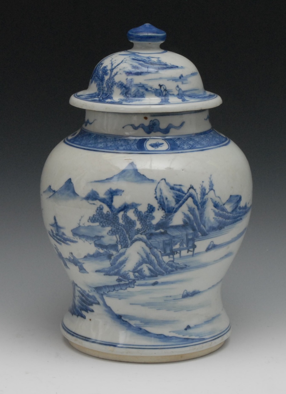 A Chinese blue and white ginger jar and cover, decorated with figures in a landscape, 31cm high,