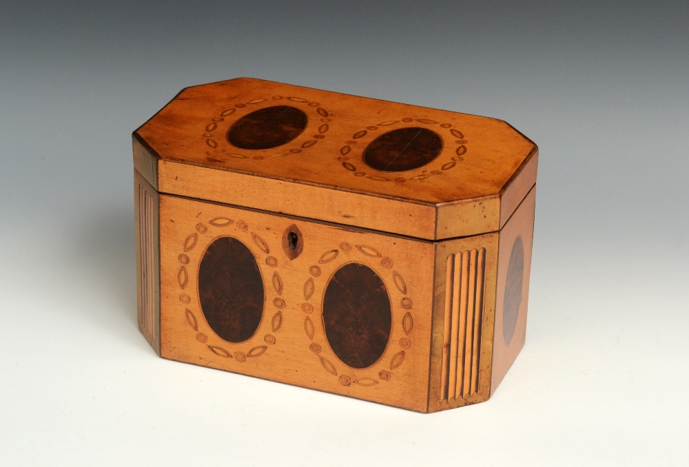A George III satinwood canted rectangular tea caddy, hinged cover enclosing lidded twin