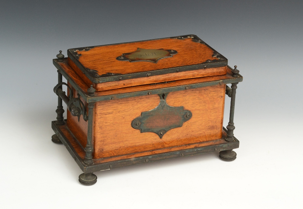 A Victorian Neo-Gothic E.P.N.S. mounted oak tea caddy, hinged cover enclosing a pair of lidded