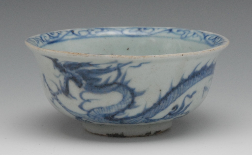 A 14th century Yuan dynasty blue and white dragon bowl, decorated in underglaze blue with three-toed