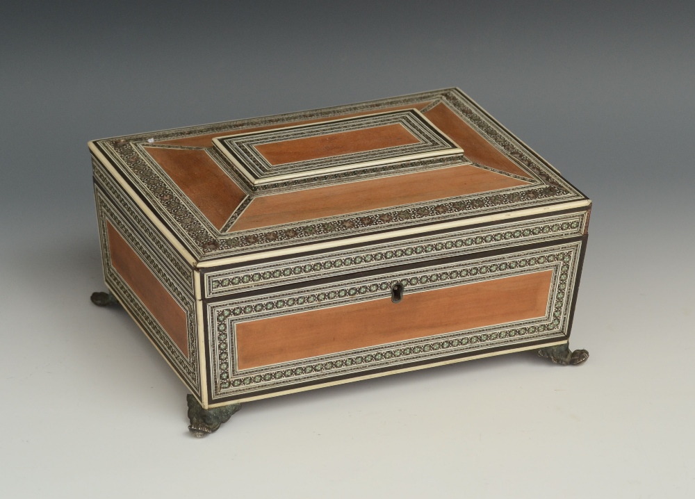 A 19th century Anglo-Indian ivory, sandalwood and sedali marquetry sarcophagus work box, hinged