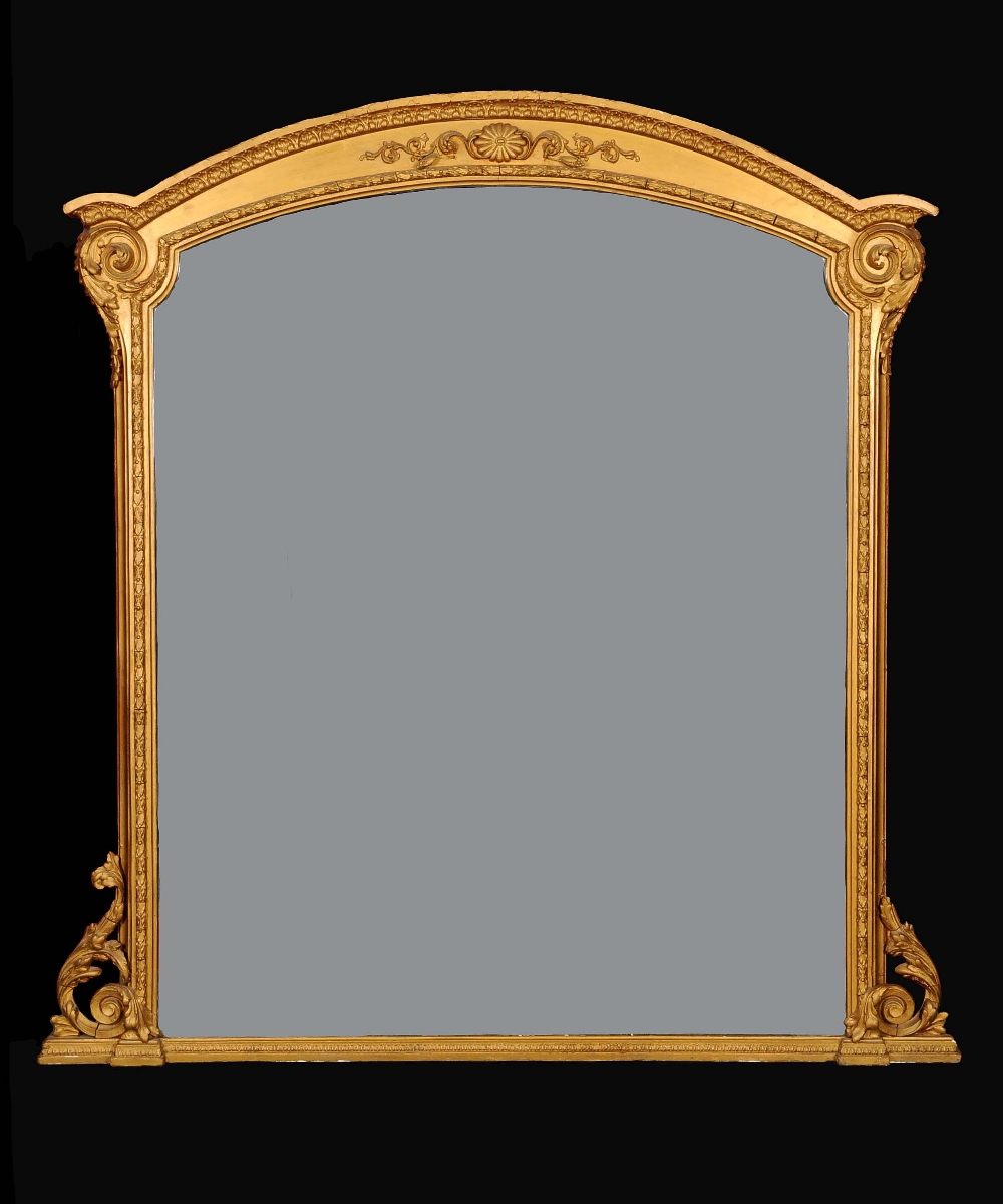 A 19th century giltwood and gesso arched rectangular overmantel mirror, the framed with bands of